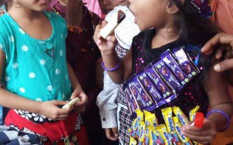 Children eating chocolate during Chocolate Day at RISHS International CBSE School Arcot
