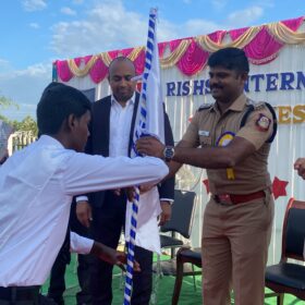 Flag handover in Investiture ceremony at RISHS International CBSE School Arcot