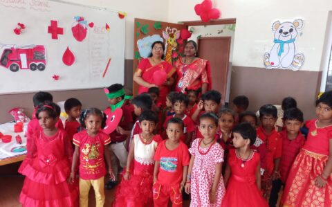 Group photo with Kids at Red day Celebration at RISHS International CBSE School Arcot