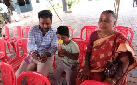 Kid with his parent at Fathers Day Celebration at RISHS International CBSE School Arcot