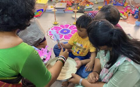 Principal giving Pen to a Student during Vijayadasami at RISHS International CBSE School Arcot