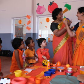 Principal with Kids During Orange Day at RISHS International CBSE School Arcot