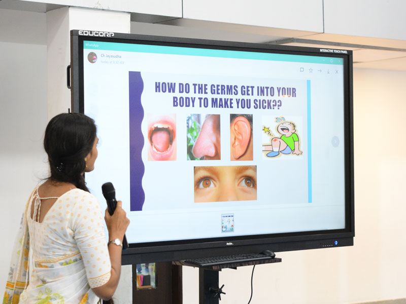 RISHS International School Staff Teaches Using a Digital Smart Board Arcot