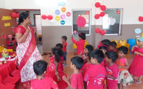 Teacher Playing With Kids at Red day Celebration at RISHS International CBSE School Arcot
