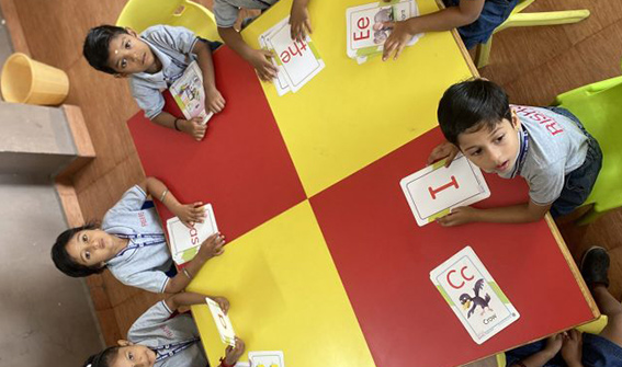 Kindergarten Kids reading RISHS International CBSE School Arcot