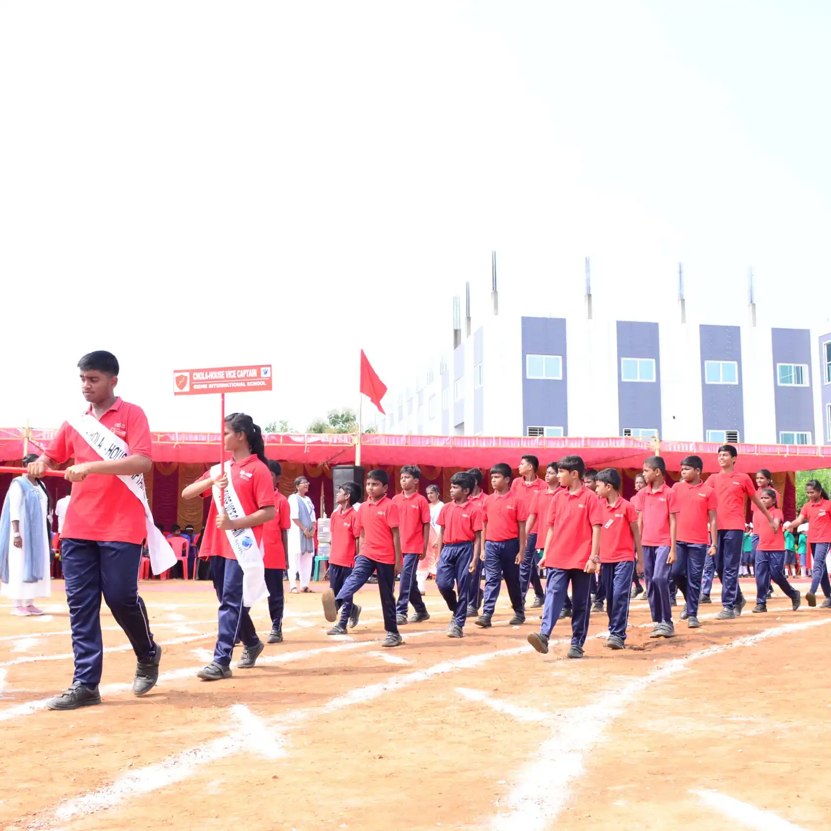 cholas-group-marching-during-sports-day-at-rishs-international-cbse-school-arcot-scaled